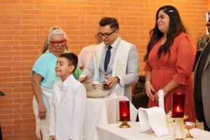 Young boy in white during religious ceremony